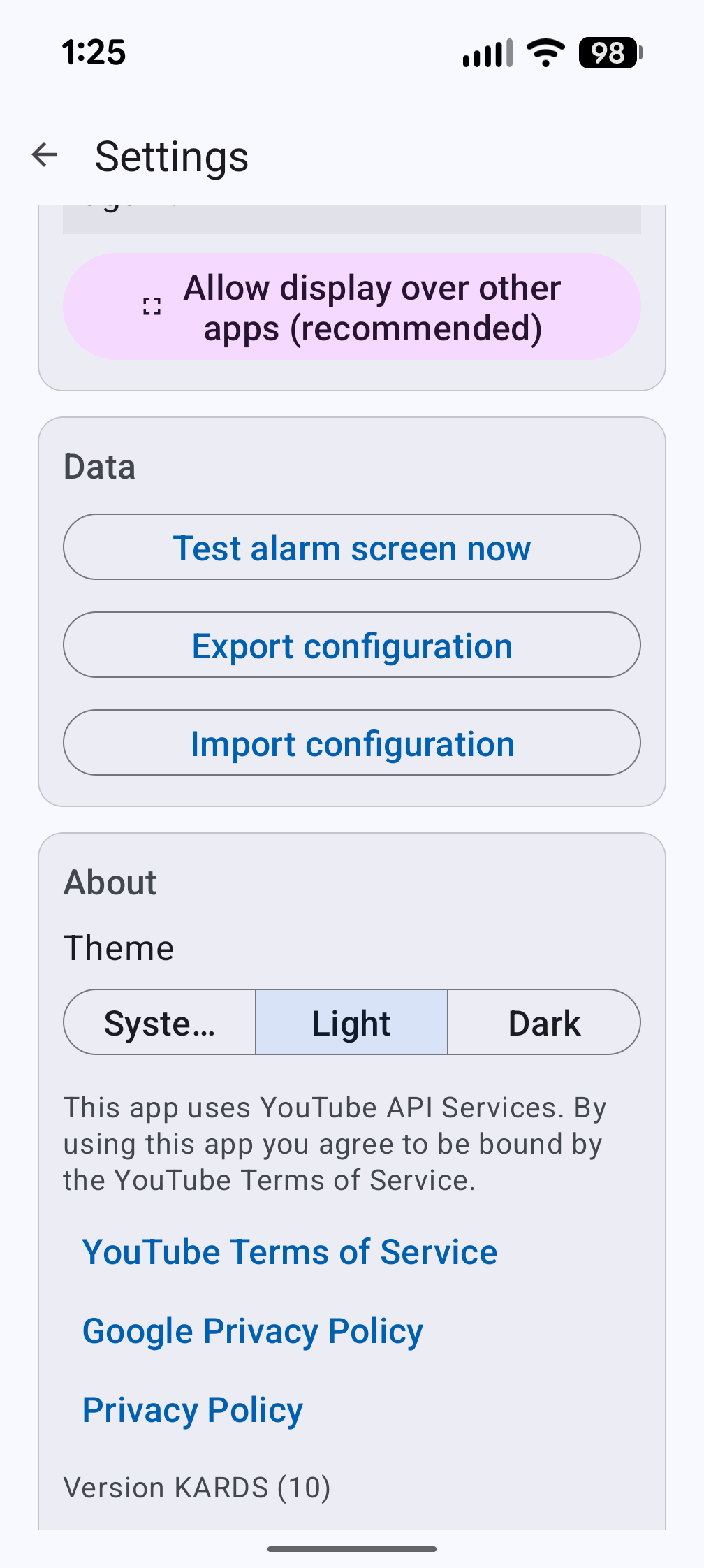 Settings screen showing theme toggle with System, Light, and Dark options, privacy links, and app version