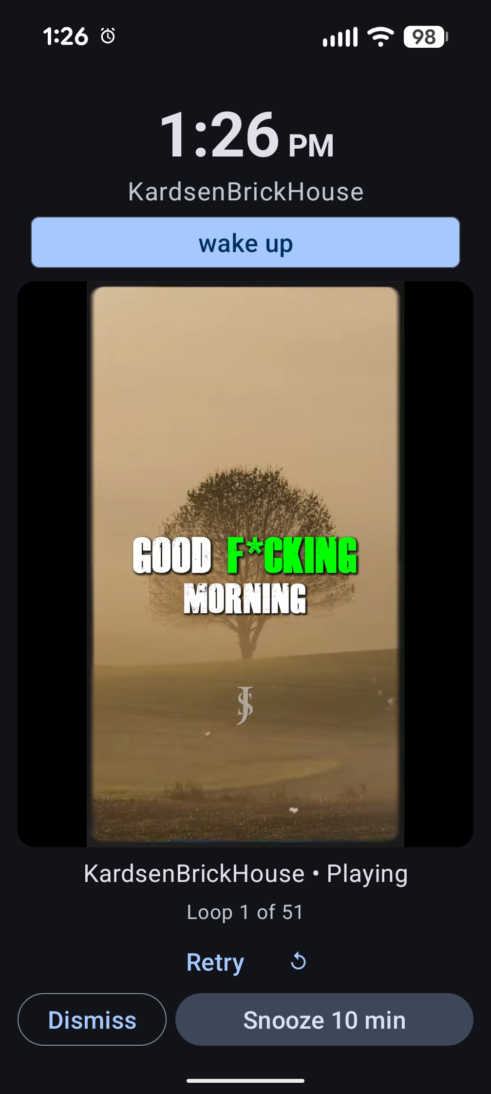 Alarm playing full-screen in light mode with YouTube Short video, dismiss and snooze buttons